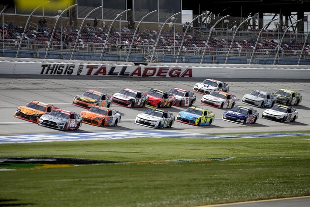 Austin Cindric (22) leads a pack of cars pass during the AG-PRO 300 Xfinity Series auto race at Talladega Superspeedway Saturday, April 24, 2021 in Talladega, Ala. (AP Photo/Butch Dill)