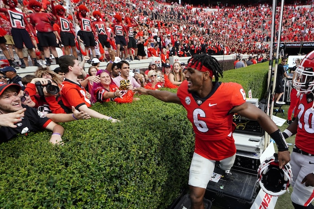 Georgia running back Kenny McIntosh (6) celebrates with the fans after defeating Arkansas in an NCAA college football game Saturday, Oct. 2, 2021, in Athens, Ga.. (AP Photo/John Bazemore)
