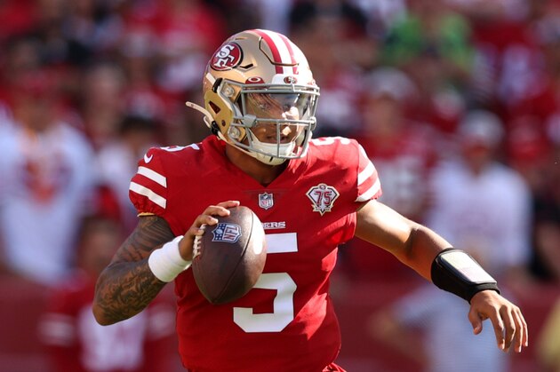 SANTA CLARA, CALIFORNIA - OCTOBER 03: Trey Lance #5 of the San Francisco 49ers scrambles as he looks to throw the ball during the fourth quarter against the Seattle Seahawks at Levi's Stadium on October 03, 2021 in Santa Clara, California. (Photo by Ezra Shaw/Getty Images)