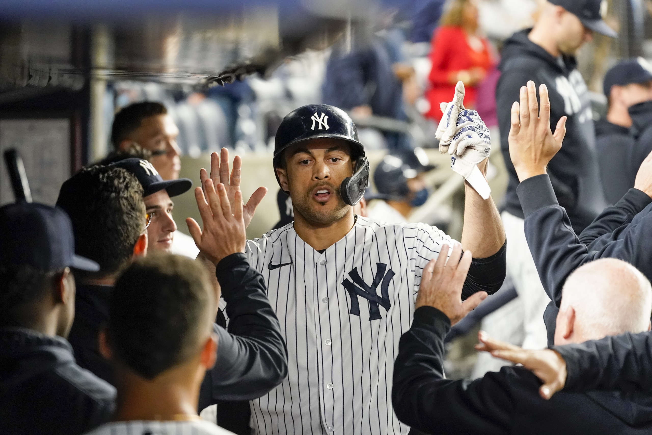 New York Yankees' Giancarlo Stanton celebrates with his teammates after scoring off a bunt by Joey Gallo in the ninth inning of a baseball game against the Tampa Bay Rays, Friday, Oct. 1, 2021, in New York. The Rays won 4-3. (AP Photo/Mary Altaffer) New York Yankees' Giancarlo Stanton celebrates with his teammates after scoring off a bunt by Joey Gallo in the ninth inning of a baseball game against the Tampa Bay Rays, Friday, Oct. 1, 2021, in New York. The Rays won 4-3. (AP Photo/Mary Altaffer)