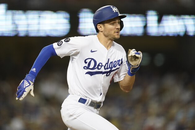 Los Angeles Dodgers' Trea Turner runs to first base as he grounds out in to a double play during the third inning of a baseball game against the Milwaukee Brewers Saturday, Oct. 2, 2021, in Los Angeles. (AP Photo/Ashley Landis)