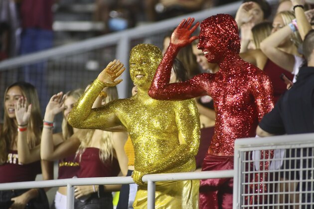The Garnet & Gold Guys do The Chop in the third quarter of an NCAA college football game between Florida State and Jacksonville State Saturday, Sept. 11, 2021, in Tallahassee, Fla. Jacksonville State won 20-17. (AP Photo/Phil Sears)