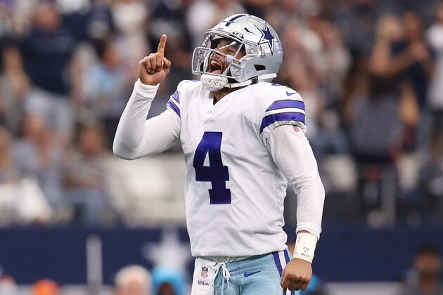 ARLINGTON, TEXAS - OCTOBER 03: Dak Prescott #4 of the Dallas Cowboys celebrates a touchdown during the second quarter against the Carolina Panthers at AT&T Stadium on October 03, 2021 in Arlington, Texas. (Photo by Tom Pennington/Getty Images)