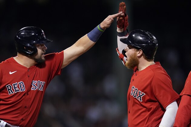 Boston Red Sox's Alex Verdugo, right, celebrates his two-run single with Kyle Schwarber, left, in the seventh inning of an American League Wild Card playoff baseball game against the New York Yankees at Fenway Park, Tuesday, Oct. 5, 2021, in Boston. (AP Photo/Charles Krupa)