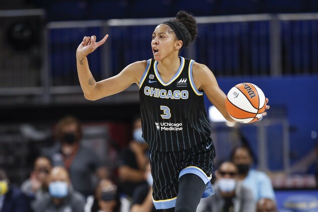 Chicago Sky center Candace Parker brings the ball up court against the Dallas Wings during the first half in the first round of the WNBA basketball playoffs, Thursday, Sept. 23, 2021, in Chicago. (AP Photo/Kamil Krzaczynski)
