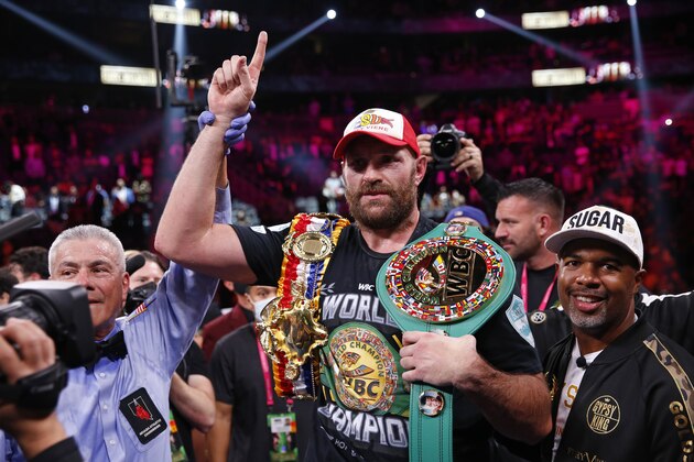 Tyson Fury, of England, celebrates after defeating Deontay Wilder in a heavyweight championship boxing match Saturday, Oct. 9, 2021, in Las Vegas. (AP Photo/Chase Stevens)