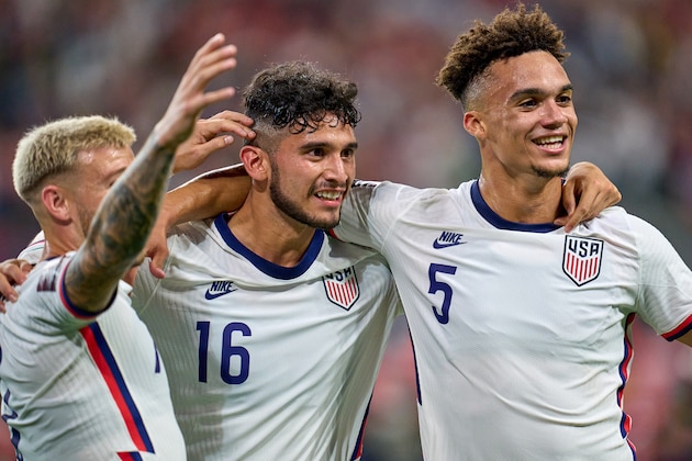 AUSTIN, TX - OCTOBER 07: United States forward Ricardo Pepi (16) celebrates with United States defender Antonee Robinson (5) and teammates after scoring a goal during a CONCACAF World Cup qualifying match between the United States and Jamaica on October 07, 2021 at Q2 Stadium in Austin, TX. (Photo by Robin Alam/Icon Sportswire via Getty Images)