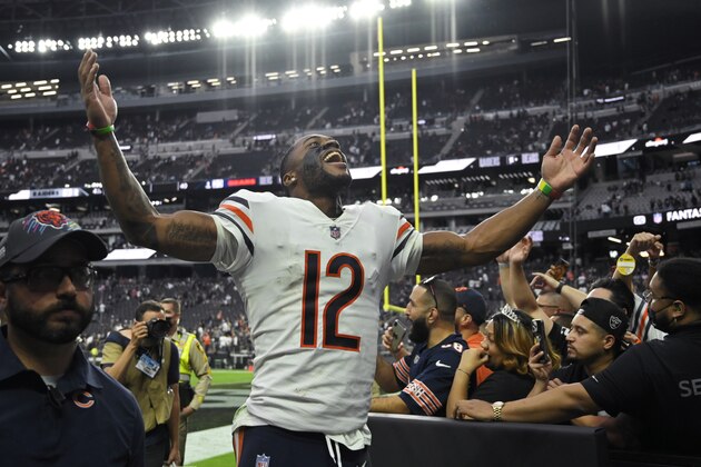 Chicago Bears wide receiver Allen Robinson (12) celebrates as he runs off the field after the Chicago Bears defeated the Las Vegas Raiders in an NFL football game, Sunday, Oct. 10, 2021, in Las Vegas. (AP Photo/David Becker)