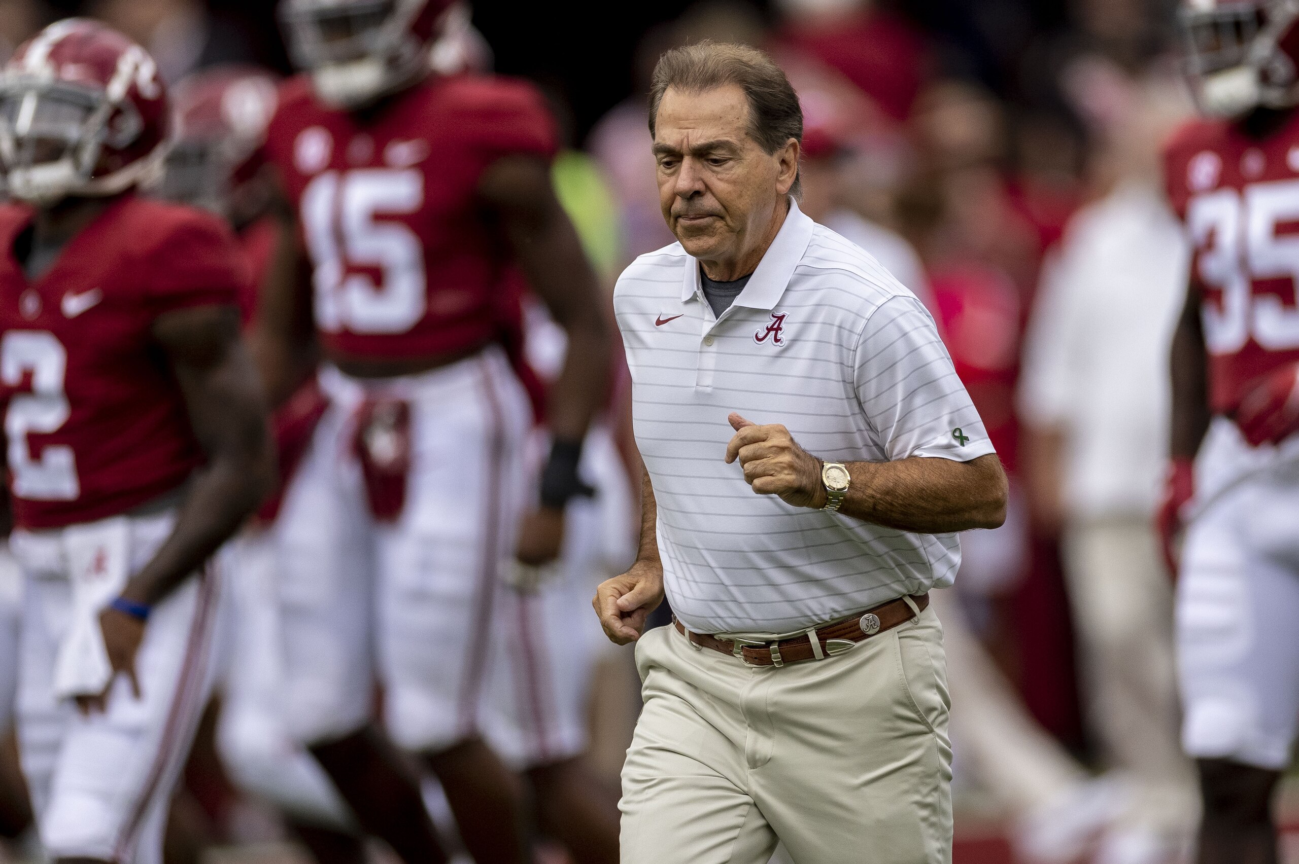 Alabama head coach Nick Saban leads his team onto the field for warm-ups before an NCAA college football game against Mississippi, Saturday, Oct. 2, 2021, in Tuscaloosa, Ala. (AP Photo/Vasha Hunt)