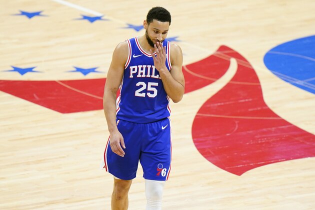 FILE - In this June 16, 2021 file photo, Philadelphia 76ers' Ben Simmons wipes his face during the second half of Game 5 in a second-round NBA basketball playoff series against the Atlanta Hawks in Philadelphia. Simmons will not report to the 76ers when they open training camp on Tuesday, Sept. 28, 2021. Team President Daryl Morey said thereâ€™s still hope Simmons will return at some point. (AP Photo/Matt Slocum)