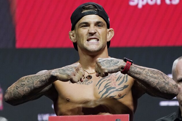 Dustin Poirier poses during a ceremonial weigh-in for a UFC 264 mixed martial arts bout Friday, July 9, 2021, in Las Vegas. Poirier is scheduled to fight Conor McGregor in a lightweight bout Saturday in Las Vegas (AP Photo/John Locher)