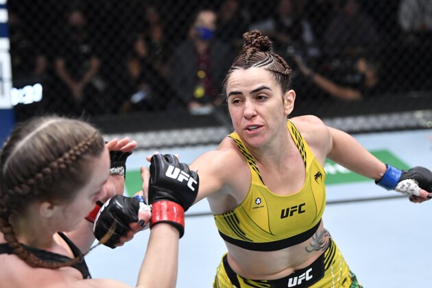 LAS VEGAS, NEVADA - OCTOBER 16: (R-L) Norma Dumont of Brazil punches Aspen Ladd in a featherweight fight during the UFC Fight Night event at UFC APEX on October 16, 2021 in Las Vegas, Nevada. (Photo by Chris Unger/Zuffa LLC)