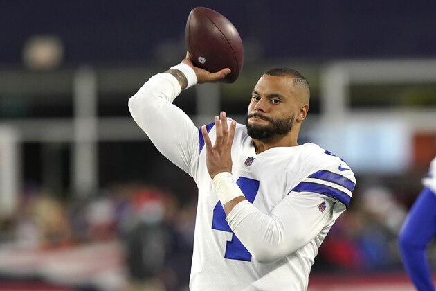 Dallas Cowboys quarterback Dak Prescott (4) warms up prior to the second half of an NFL football game, Sunday, Oct. 17, 2021, in Foxborough, Mass. (AP Photo/Steven Senne)