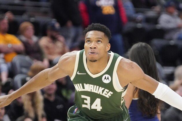 Milwaukee Bucks forward Giannis Antetokounmpo (34) takes the court at the start of the first half of a preseason NBA basketball game against the Utah Jazz Wednesday, Oct. 13, 2021, in Salt Lake City. (AP Photo/Rick Bowmer)
