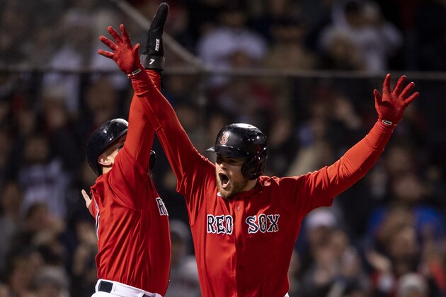 BOSTON, MA - OCTOBER 18: Christian Arroyo #39 of the Boston Red Sox reacts with Christian Vazquez #9 after hitting a two-run home run during the third inning of game three of the 2021 American League Championship Series against the Houston Astros at Fenway Park on October 18, 2021 in Boston, Massachusetts. (Photo by Billie Weiss/Boston Red Sox/Getty Images)
