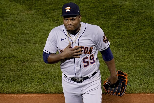 Houston Astros starting pitcher Framber Valdez celebrates the end of the seventh inning against the Boston Red Sox in Game 5 of baseball's American League Championship Series Wednesday, Oct. 20, 2021, in Boston. (AP Photo/Charles Krupa)