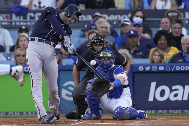 Atlanta Braves' Freddie Freeman hits a two-run home run during the first inning against the Los Angeles Dodgers in Game 5 of baseball's National League Championship Series Thursday, Oct. 21, 2021, in Los Angeles. (AP Photo/Marcio Jose Sanchez)