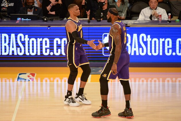 LOS ANGELES, CA - OCTOBER 22: Russell Westbrook #0 and LeBron James #6 of the Los Angeles Lakers shake hands against the Phoenix Suns on October 22, 2021 at STAPLES Center in Los Angeles, California. NOTE TO USER: User expressly acknowledges and agrees that, by downloading and/or using this Photograph, user is consenting to the terms and conditions of the Getty Images License Agreement. Mandatory Copyright Notice: Copyright 2021 NBAE (Photo by Ned Dishman/NBAE via Getty Images)