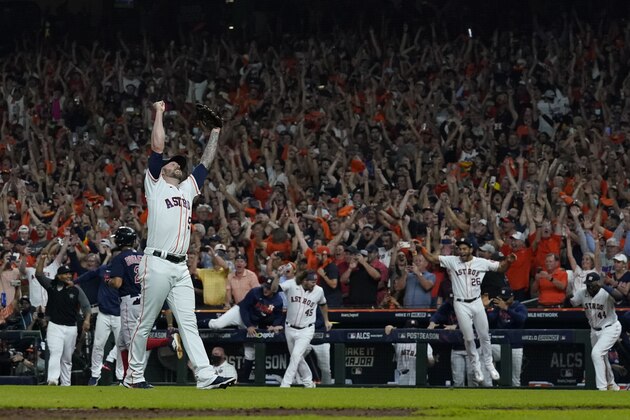 Houston Astros relief pitcher Ryan Pressly celebrates their win against the Boston Red Sox in Game 6 of baseball's American League Championship Series Friday, Oct. 22, 2021, in Houston. The Astros won 5-0, to win the ALCS series in game six.(AP Photo/David J. Phillip)