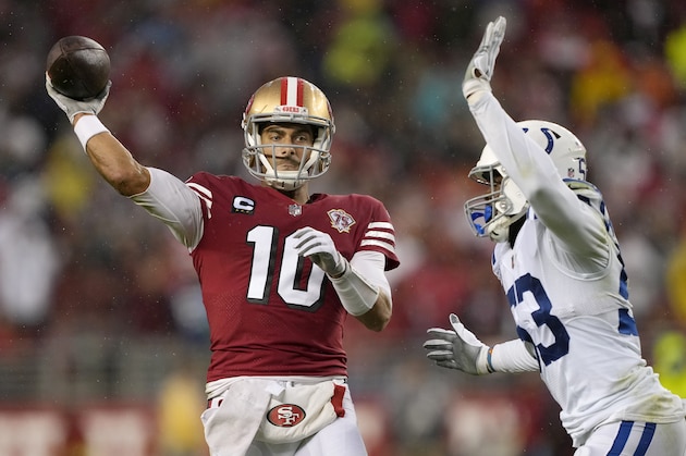San Francisco 49ers quarterback Jimmy Garoppolo (10) passes against Indianapolis Colts outside linebacker Darius Leonard during the first half of an NFL football game in Santa Clara, Calif., Sunday, Oct. 24, 2021. (AP Photo/Tony Avelar)