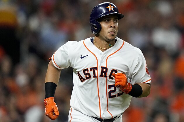 Houston Astros' Michael Brantley runs to first against the Boston Red Sox during the third inning in Game 6 of baseball's American League Championship Series Friday, Oct. 22, 2021, in Houston. (AP Photo/David J. Phillip)