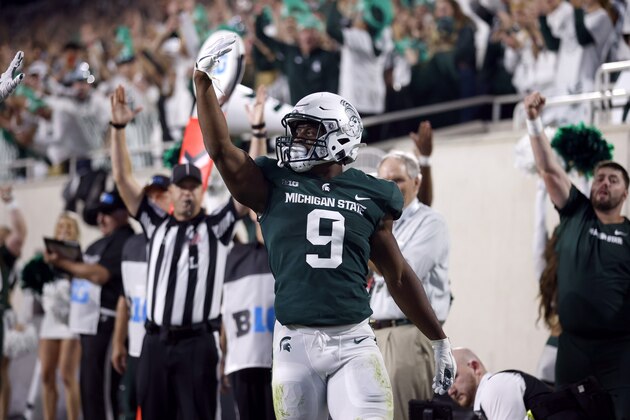 Michigan State running back Kenneth Walker III celebrates his touchdown run during an NCAA college football game against Western Kentucky, Saturday, Oct. 2, 2021, in East Lansing, Mich. (AP Photo/Al Goldis)