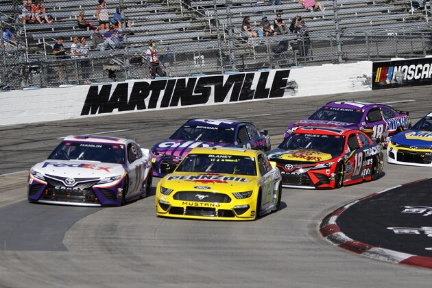 MARTINSVILLE, VA - APRIL 11: #11: Denny Hamlin, Joe Gibbs Racing, Toyota Camry FedEx Office, #12: Ryan Blaney, Team Penske, Ford Mustang Menards/Pennzoil #19: Martin Truex Jr., Joe Gibbs Racing, Toyota Camry Bass Pro during the running of the rain delayed Blue-Emu Maximum Pain Relief 500 on April 11, 2021 at Martinsville Speedway in Martinsville,Virginia (Photo by Jeff Robinson/Icon Sportswire via Getty Images)