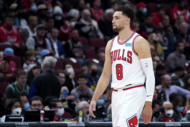 Chicago Bulls guard Zach LaVine walks on the court during the first half of an NBA basketball game against the Detroit Pistons in Chicago, Saturday, Oct. 23, 2021. (AP Photo/Nam Y. Huh)