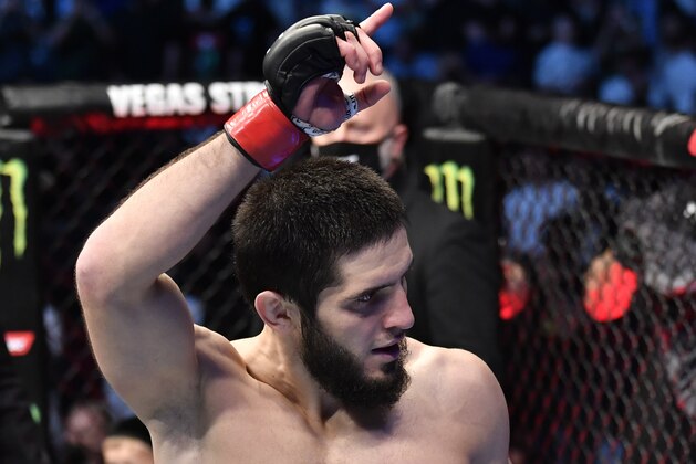 ABU DHABI, UNITED ARAB EMIRATES - OCTOBER 30: Islam Makhachev of Russia celebrates after his submission victory over Dan Hooker of New Zealand in a lightweight fight during the UFC 267 event at Etihad Arena on October 30, 2021 in Yas Island, Abu Dhabi, United Arab Emirates. (Photo by Chris Unger/Zuffa LLC)