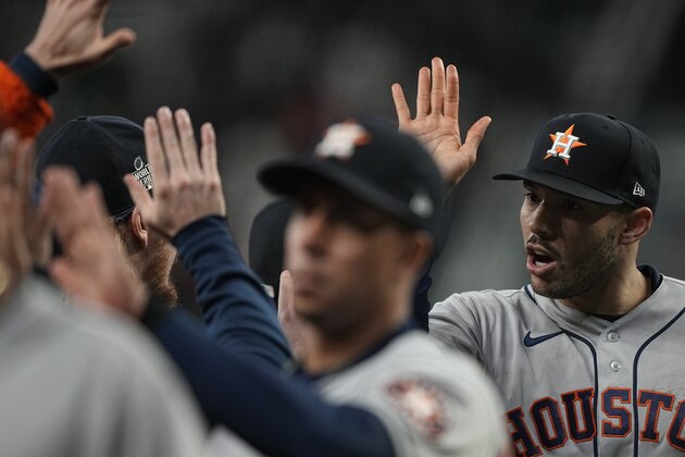 Houston Astros shortstop Carlos Correa celebrates their win in Game 5 of baseball's World Series between the Houston Astros and the Atlanta Braves Monday, Nov. 1, 2021, in Atlanta. The Astros won 9-5. The Braves lead the series 3-2 games. (AP Photo/David J. Phillip)