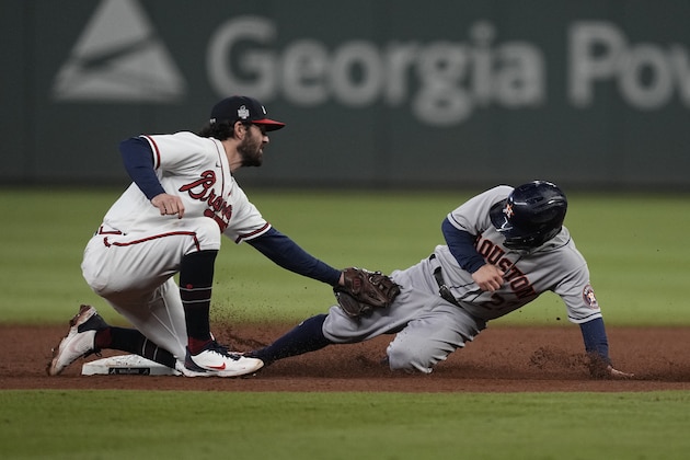 Houston Astros' Jose Altuve steals second past Atlanta Braves shortstop Dansby Swanson during the eighth inning in Game 5 of baseball's World Series between the Houston Astros and the Atlanta Braves Sunday, Oct. 31, 2021, in Atlanta. (AP Photo/David J. Phillip) Houston Astros' Jose Altuve steals second past Atlanta Braves shortstop Dansby Swanson during the eighth inning in Game 5 of baseball's World Series between the Houston Astros and the Atlanta Braves Sunday, Oct. 31, 2021, in Atlanta. (AP Photo/David J. Phillip)