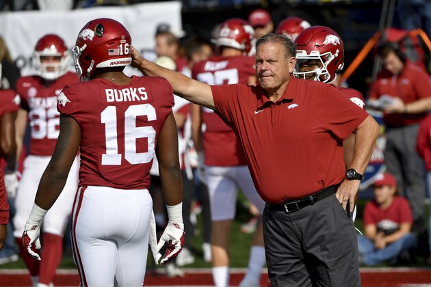 Arkansas coach Sam Pittman talks to Treylon Burks (16) before their game against Pine Bluff during an NCAA college football game Saturday, Oct. 23, 2021, in Little Rock, Ark. (AP Photo/Michael Woods)