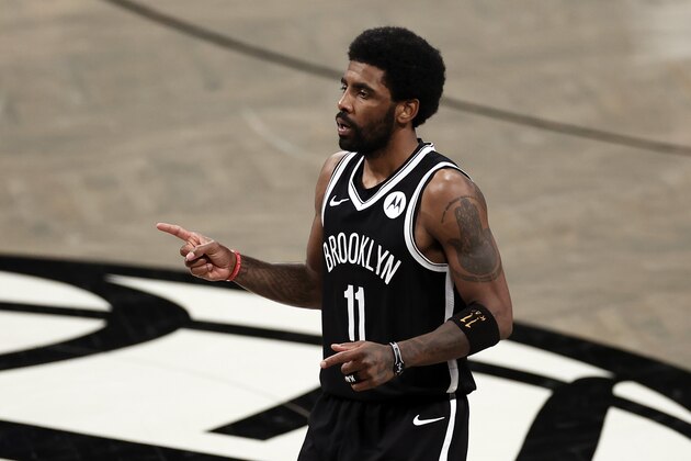 Brooklyn Nets guard Kyrie Irving (11) reacts against the Milwaukee Bucks during the second half of Game 1 of an NBA basketball second-round playoff series Saturday, June 5, 2021, in New York. (AP Photo/Adam Hunger)
