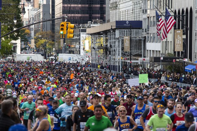 FILE - In this Nov. 3, 2019, file photo, runners take part in the New York City Marathon. The New York City Marathon scheduled for Nov. 1, 2020, has been cancelled because of the coronavirus pandemic.  New York Road Runners announced the cancellation of the world's largest marathon Wednesday, June 24, 2020, after coordinating with the mayor's office and deciding the race posed too many health and safety concerns for runners, volunteers, spectators and others. (AP Photo/Eduardo Munoz Alvarez, File)