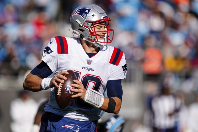 New England Patriots quarterback Mac Jones plays against the Carolina Panthers during the second half of an NFL football game Sunday, Nov. 7, 2021, in Charlotte, N.C. (AP Photo/Jacob Kupferman)