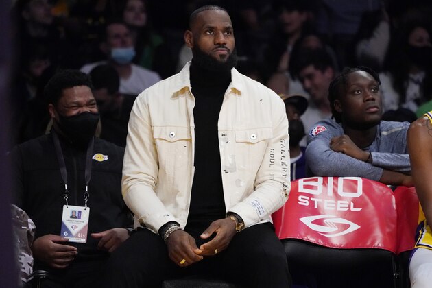 Los Angeles Lakers forward LeBron James sits on the bench during the first half of the team's NBA basketball game against the Oklahoma City Thunder on Thursday, Nov. 4, 2021, in Los Angeles. (AP Photo/Marcio Jose Sanchez)