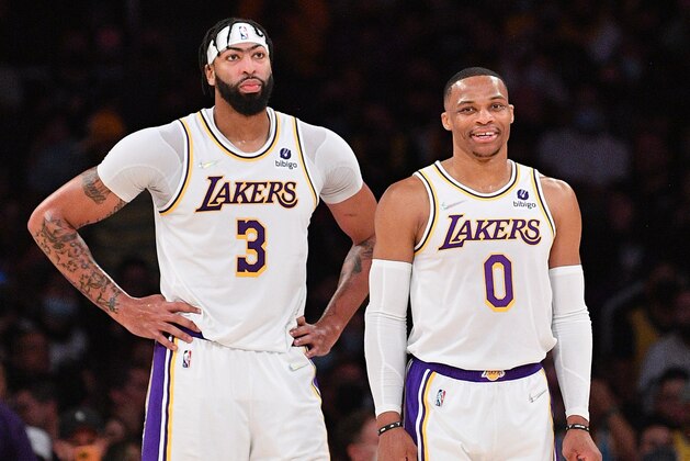 LOS ANGELES, CALIFORNIA - NOVEMBER 14: Anthony Davis #3 (L) and Russell Westbrook #0 of the Los Angeles Lakers look on during the second half of the game against the San Antonio Spurs at Staples Center on November 14, 2021 in Los Angeles, California. NOTE TO USER: User expressly acknowledges and agrees that, by downloading and/or using this Photograph, user is consenting to the terms and conditions of the Getty Images License Agreement. (Photo by Allen Berezovsky/Getty Images)