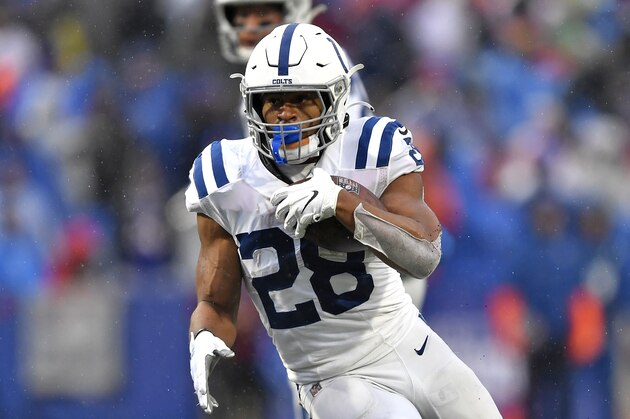 Indianapolis Colts running back Jonathan Taylor (28) carries the ball during the second half of an NFL football game against the Buffalo Bills in Orchard Park, N.Y., Sunday, Nov. 21, 2021. (AP Photo/Adrian Kraus)