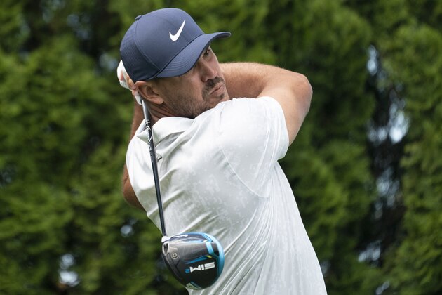Brooks Koepka hits off the ninth tee during the pro-am ahead of the Travelers Championship golf tournament at TPC River Highlands, Wednesday, June 23, 2021, in Cromwell, Conn. (AP Photo/John Minchillo)