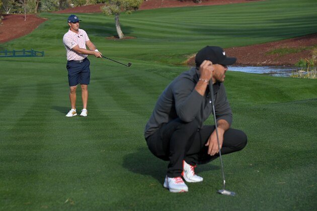 LAS VEGAS, NEVADA - NOVEMBER 26: Bryson DeChambeau plays his shot on the fifth hole as Brooks Koepka looks on during Capital One's The Match V: Bryson v Brooks at Wynn Golf Course on November 26, 2021 in Las Vegas, Nevada. (Photo by David Becker/Getty Images for The Match)