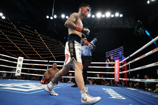 NEW YORK, NEW YORK - NOVEMBER 27:  George Kambosos knocks down Teofimo Lopez in the first round during their championship bout for Lopez’s Undisputed Lightweight title at The Hulu Theater at Madison Square Garden on November 27, 2021 in New York, New York. (Photo by Al Bello/Getty Images)