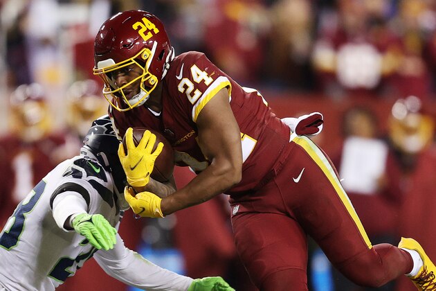 LANDOVER, MARYLAND - NOVEMBER 29: Antonio Gibson #24 of the Washington Football Team carries the ball against the Seattle Seahawks during the third quarter at FedExField on November 29, 2021 in Landover, Maryland. (Photo by Patrick Smith/Getty Images) LANDOVER, MARYLAND - NOVEMBER 29: Antonio Gibson #24 of the Washington Football Team carries the ball against the Seattle Seahawks during the third quarter at FedExField on November 29, 2021 in Landover, Maryland. (Photo by Patrick Smith/Getty Images)