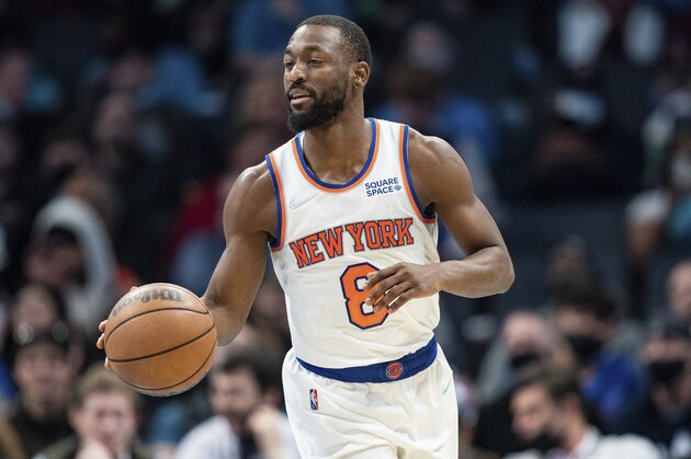 New York Knicks guard Kemba Walker (8) brings the ball up court against the Charlotte Hornets during the second half of an NBA basketball game in Charlotte, N.C., Friday, Nov. 12, 2021. (AP Photo/Jacob Kupferman)