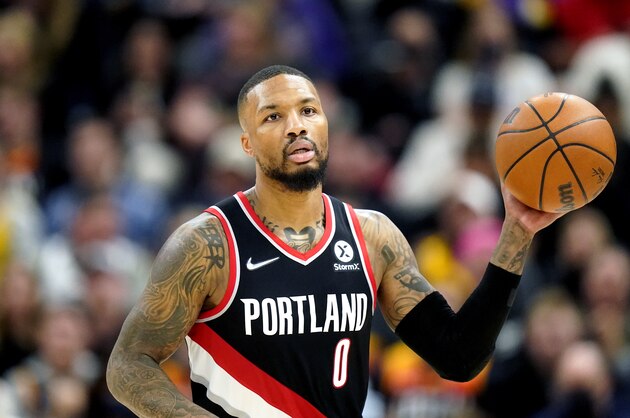 Portland Trail Blazers guard Damian Lillard (0) brings the ball up court in the first half during an NBA basketball game against the Utah Jazz Monday, Nov. 29, 2021, in Salt Lake City. (AP Photo/Rick Bowmer)
