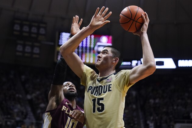 Purdue center Zach Edey (15) shoots over Florida State forward Malik Osborne (10) during the second half of an NCAA college basketball game in West Lafayette, Ind., Tuesday, Nov. 30, 2021. Purdue defeated Florida State 93-65. (AP Photo/Michael Conroy)