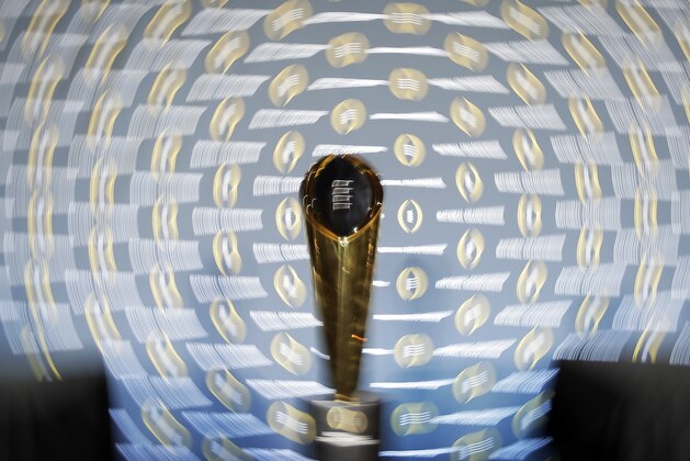The national championship trophy is seen during a news conference for the NCAA college football playoff championship game Sunday, Jan. 10, 2016, in Glendale, Ariz. (AP Photo/Chris Carlson)