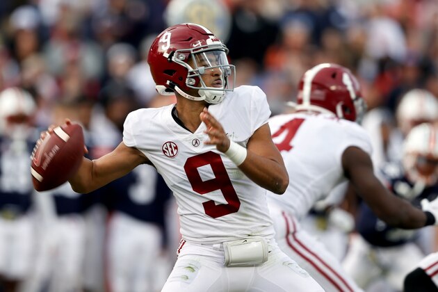 FILE -  Alabama quarterback Bryce Young (9) throws a pass against Auburn during the first half of an NCAA college football game Saturday, Nov. 27, 2021, in Auburn, Ala. (AP Photo/Butch Dill, File)