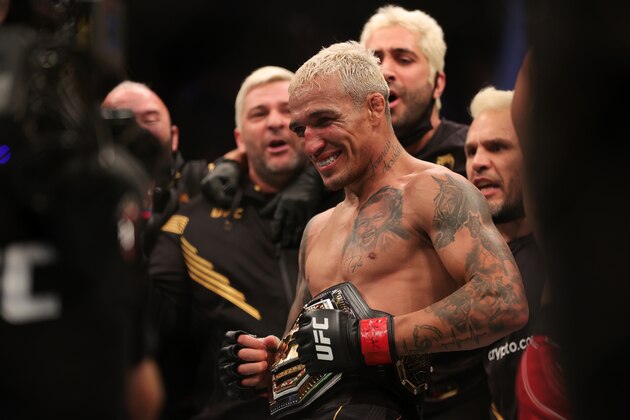 LAS VEGAS, NEVADA - DECEMBER 11: Charles Oliveira of Brazil celebrates after defeating Dustin Poirier to defend his lightweight title during the UFC 269 event at T-Mobile Arena on December 11, 2021 in Las Vegas, Nevada. (Photo by Carmen Mandato/Getty Images)