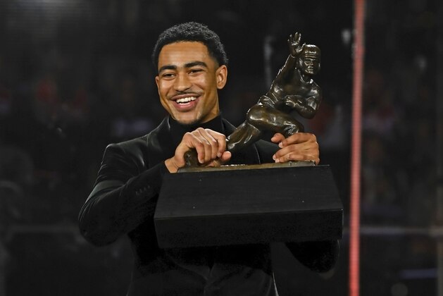 Alabama quarterback Bryce Young holds the Heisman Trophy at an award ceremony, Saturday, Dec. 11, 2021, in New York. (Todd Van Emst/Heisman Trust via AP, Pool)