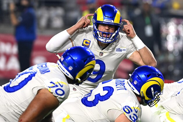 GLENDALE, ARIZONA - DECEMBER 13: Matthew Stafford #9 of the Los Angeles Rams calls a play at the line of scrimmage in the second quarter of the game against the Arizona Cardinals at State Farm Stadium on December 13, 2021 in Glendale, Arizona. (Photo by Norm Hall/Getty Images)
